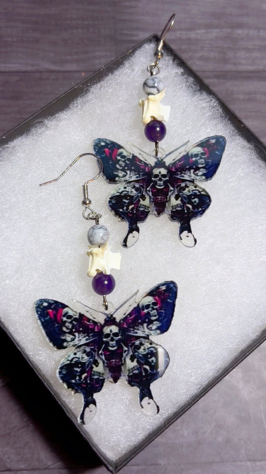 Handmade snake vertebrae earrings with moth charms