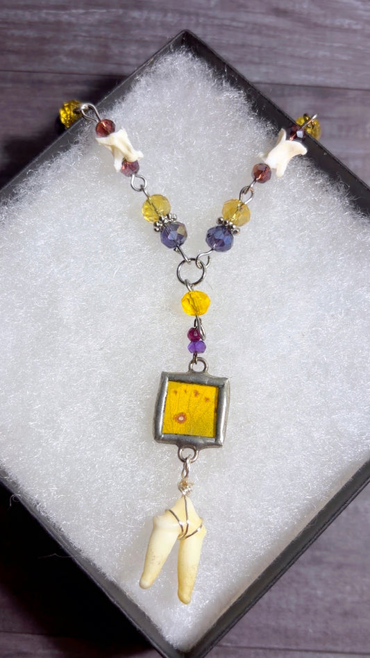 Handmade Y drop necklace with coyote tooth, snake vertebrae, and butterfly wing