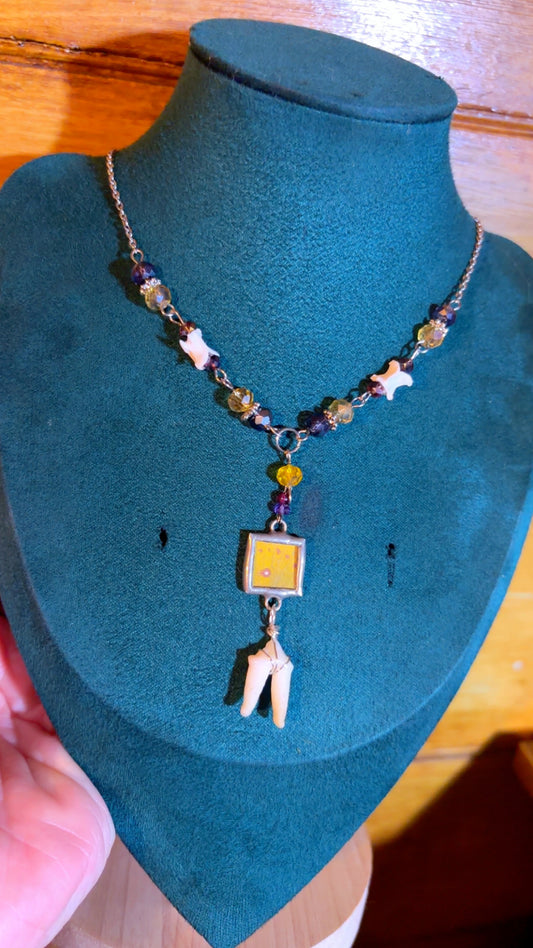 Handmade Y drop necklace with coyote tooth, snake vertebrae, and butterfly wing