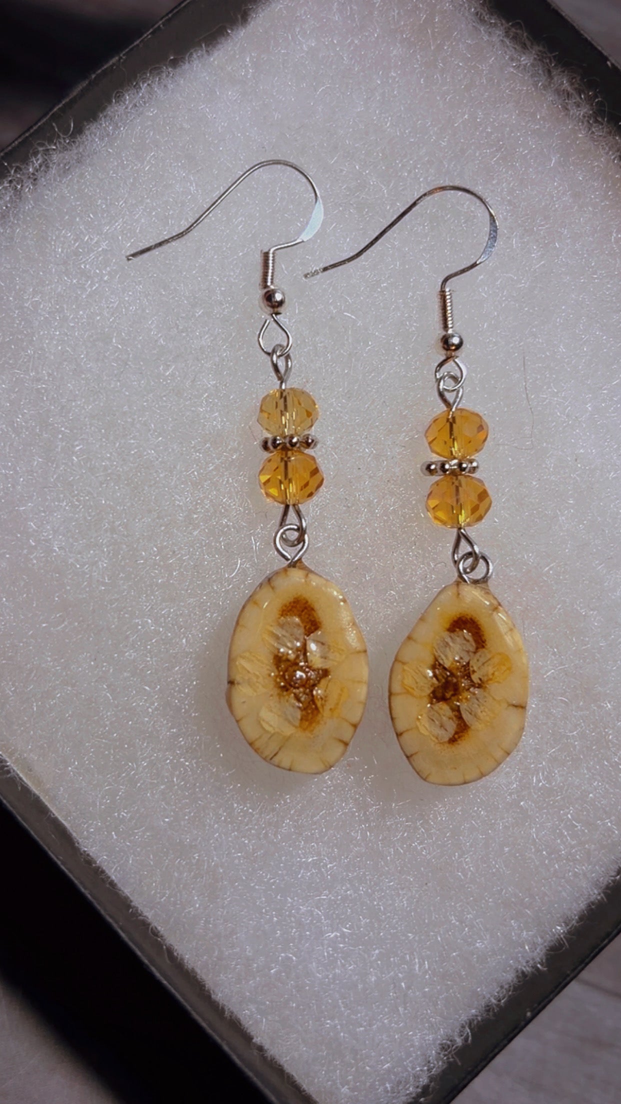 Handmade deer antler earrings with dried flowers