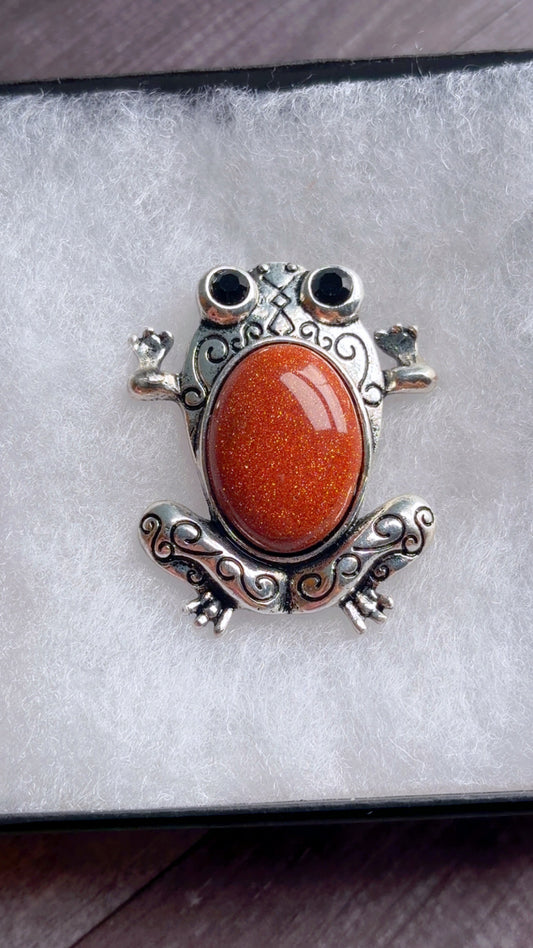 Gold sandstone (goldstone) frog brooch or pendant