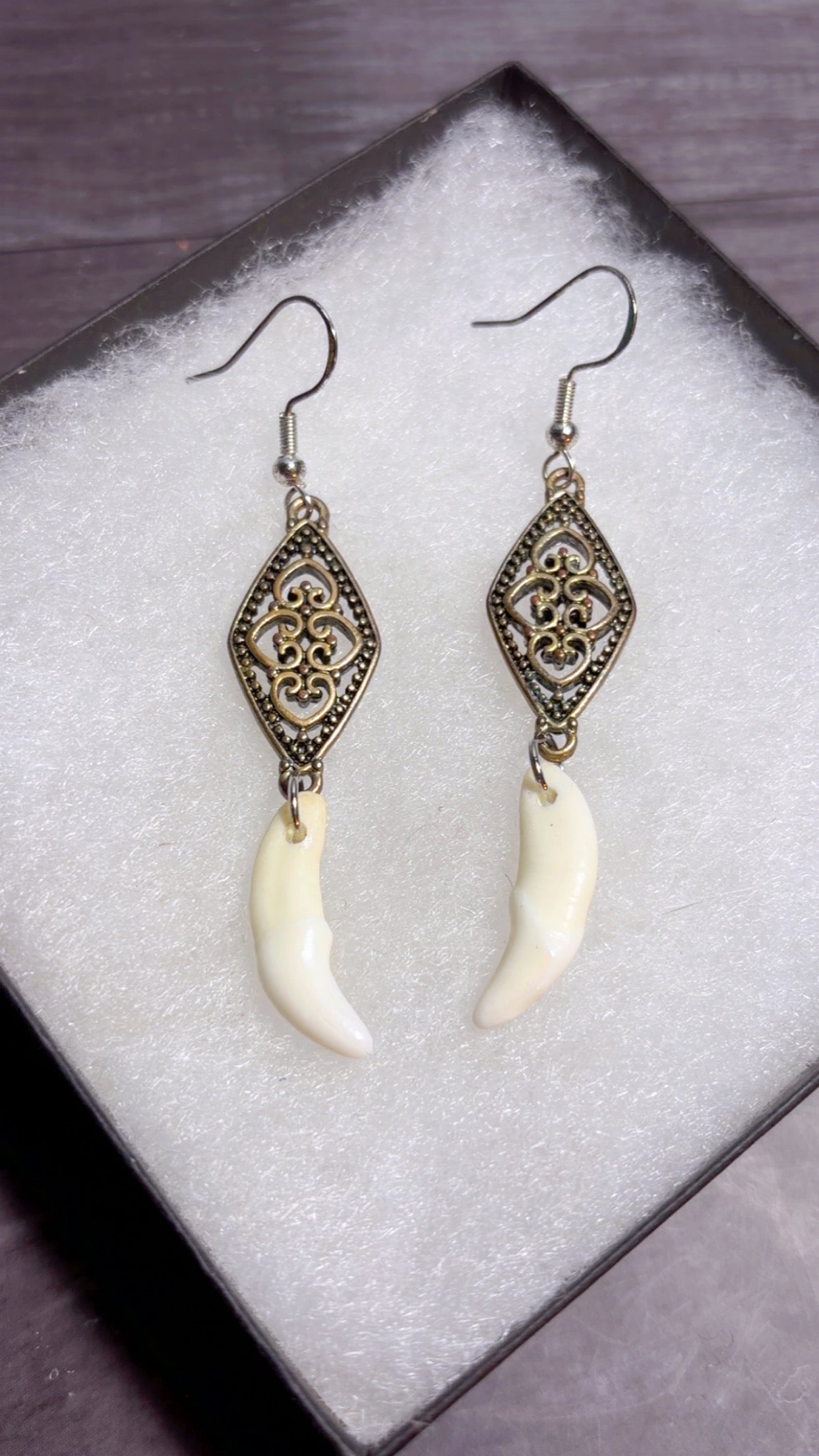 Handmade coyote fang earrings