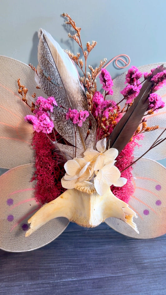 Handmade floral & feather arrangement with deer vertebrae bone