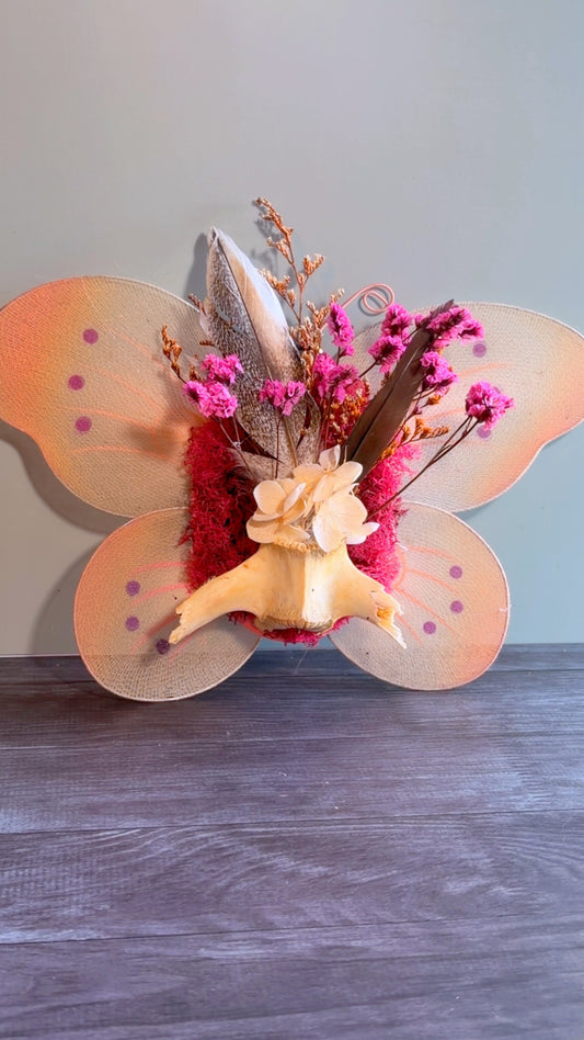Handmade floral & feather arrangement with deer vertebrae bone