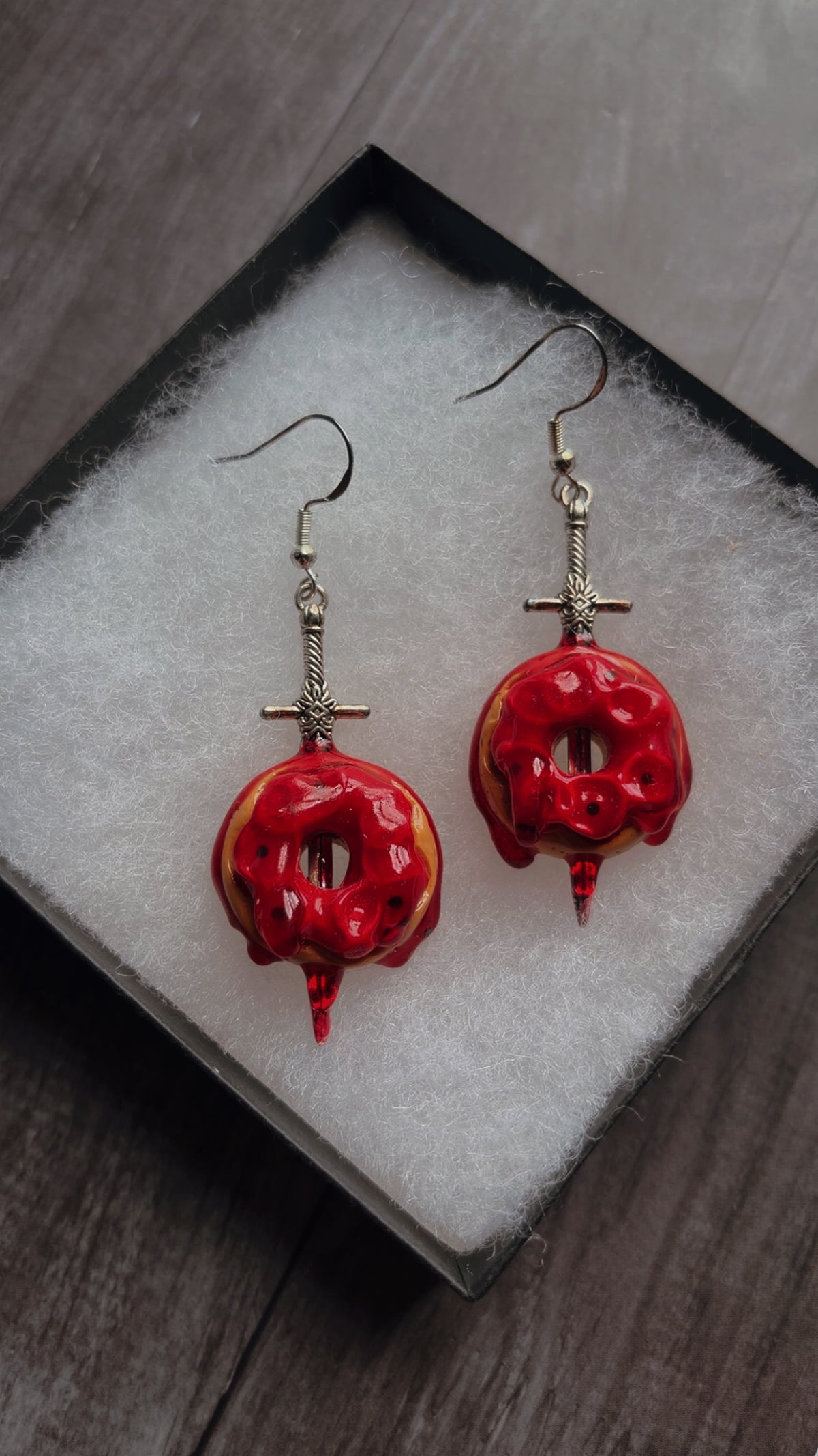 Handmade sword stabbed donut earrings